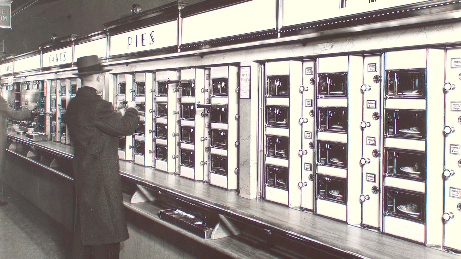 A man standing at an automat