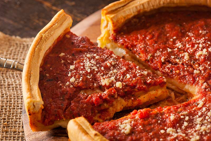 A slice of deep dish pizza 