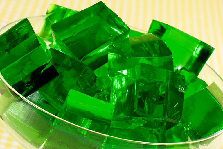A bowl of green Jell-O cubes