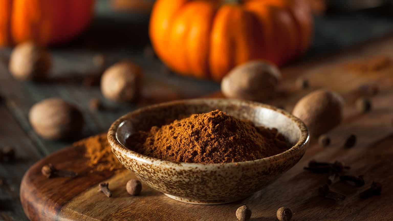 Ground spice with a pumpkin behind