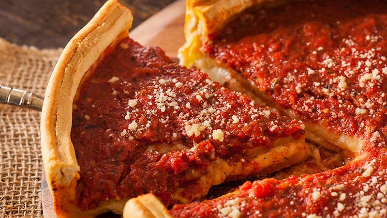 A slice of deep dish pizza 
