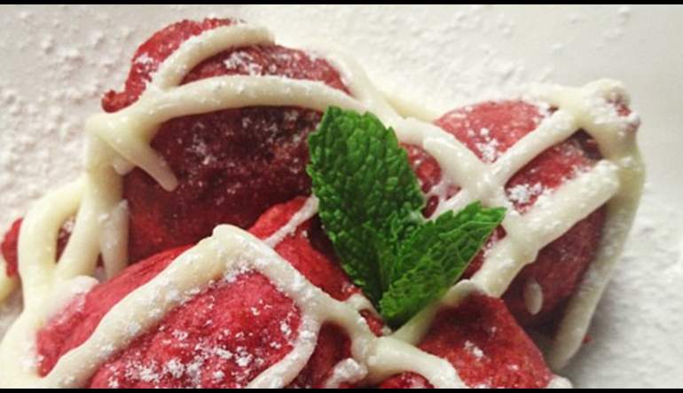 Red Velvet Beignets with Cream cheese frosting