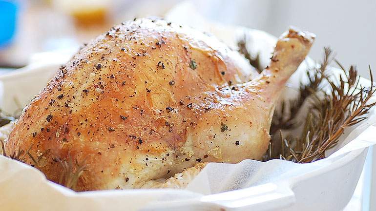 Roasted Chicken stuffed with garlic, rosemary lemon sauce