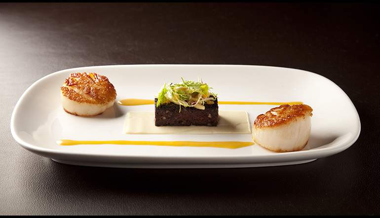 Seared Sea Scallop with Black Pudding, celery, tangerine and almond