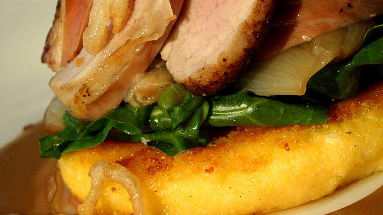 Serrano Ham Wrapped Veal Loin with Manchego Cheese Polenta, Swiss chard & Braised shallots